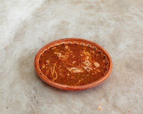 bowl of fresh garlic cloves and indian spices